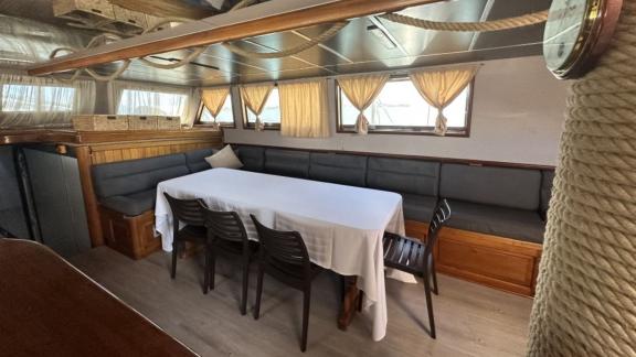 Comfortable dining area inside Gulet Aria, perfect for shared meals during the journey.