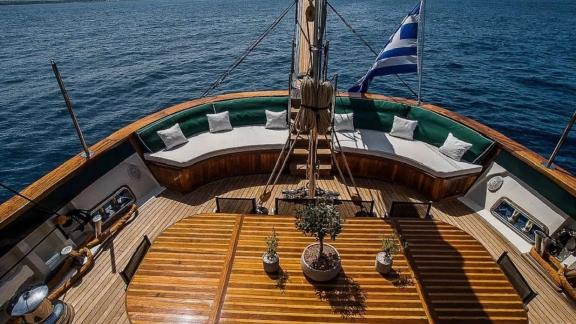 The aft deck of gulet Arktos offers comfortable seating and a table.