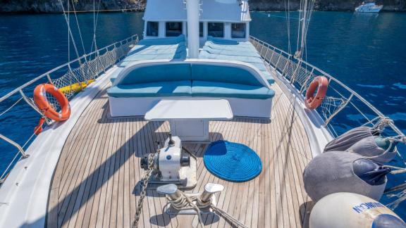 Comfortable seating area on the deck of Gulet Avuncan overlooking the deep blue Aegean Sea.