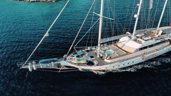 A bird's eye view of the luxurious deck of the gulet Bella Mare in Bodrum, with pool and comfortable loungers.