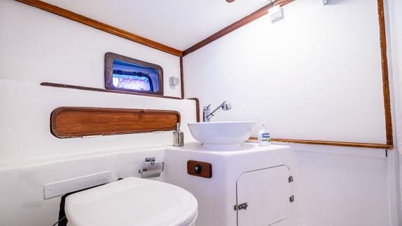 Elegant bathroom onboard the 22 meter Gulet Castiel with modern amenities and nautical ambiance.