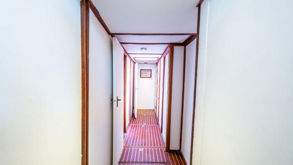 The stylish corridor of the 22 meter Gulet Castiel connects the luxurious cabins and living areas.