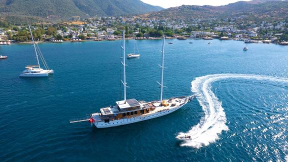 The Gulet Caustic in Bodrum with a jet ski in action, ready for water adventures.