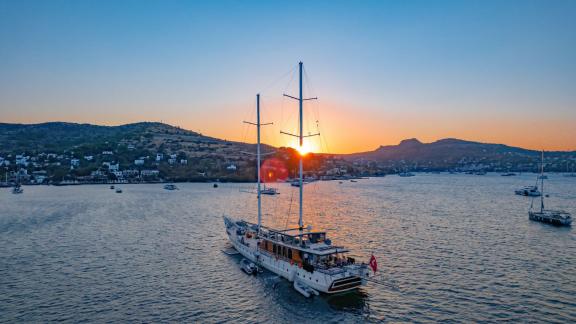 The Gulet Caustic at sea during sunset off Bodrum, perfect for romantic evenings.