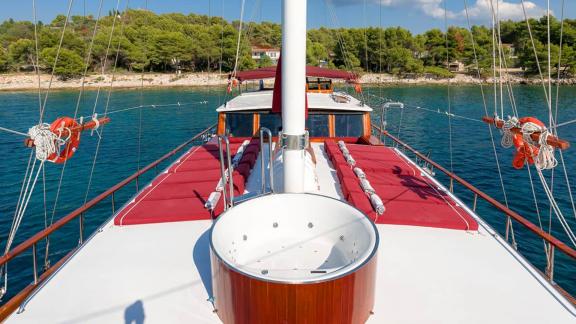 The foredeck of gulet Croatia features a jacuzzi and comfortable sunbathing cushions.