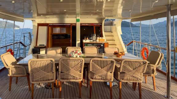 Aft deck of the Deryam gulet in the bays of Bodrum, offering space for dining and relaxation at sea.