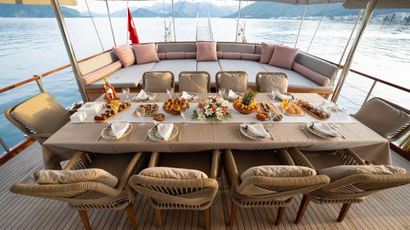 Aft deck dining area of the Deryam gulet in the bays of Bodrum, perfect for blue cruise dining experiences.