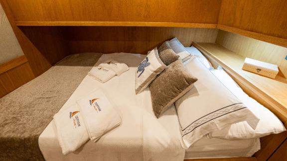 Guest cabin of the Deryam gulet in the bays of Bodrum, offering a comfortable living space for yacht holidays.