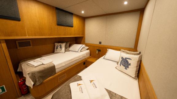 Twin guest cabin of the Deryam gulet in the bays of Bodrum, providing comfort for yacht charter holidays.