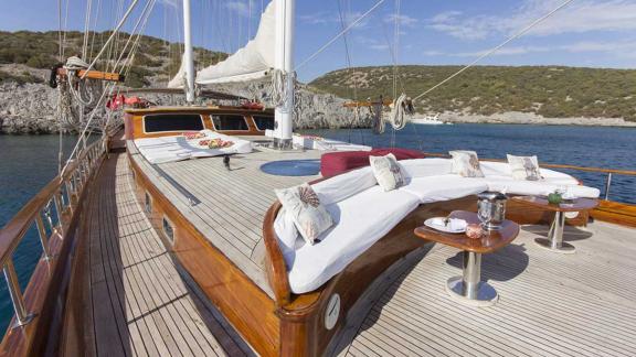 Stylish and cosy seating area on the deck of a traditional gulet.