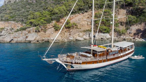 The Gulet Efe Burak anchored off the scenic coast of Fethiye.