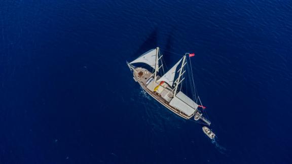 The Gulet Efe Burak sails majestically over the deep blue sea.