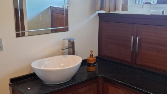Among Marmaris yacht rental options Eloa bathroom shows sink with countertop and storage cabinets onboard.