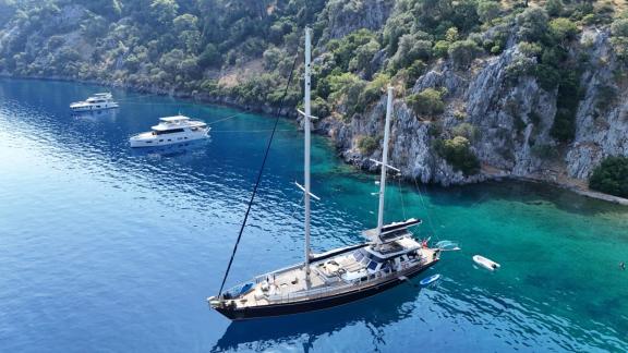 Among Marmaris yacht rental options Eloa is anchored in a peaceful bay with clear sea and natural surroundings.
