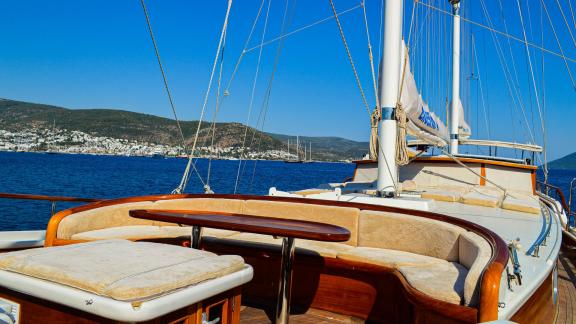 The sun deck of the Enderim A offers comfortable seating and a view of Bodrum.