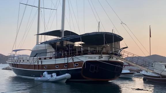 The Gulet Enver Aga at sunset in Marmaris offers a luxurious charter experience with stylish design and comfortable amen