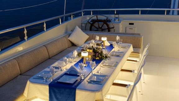 Elegant table setting for dinner on the deck of the gulet Freedom, at anchor in Marmaris.