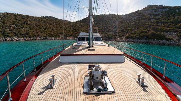 In Göcek gulet charter option Getaway foredeck with wide walking space and surrounding sea view visible.