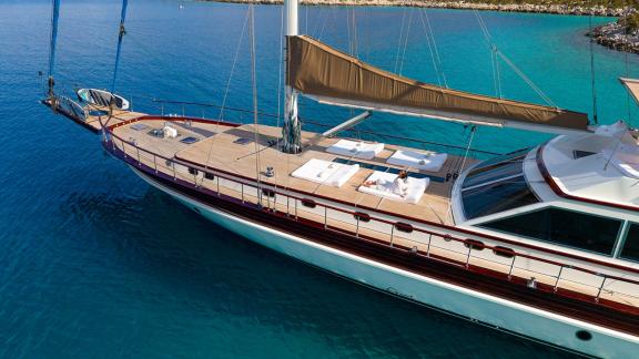 In Göcek gulet charter option Getaway foredeck with sunbeds and open sea view visible.