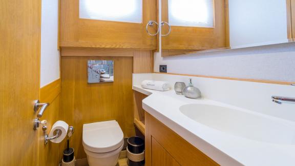 In Fethiye gulet charter option Happy Days bathroom with sink and toilet in compact layout visible.