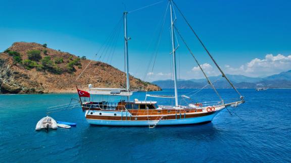 Experience the beauty of Fethiye aboard the Gulet Hasay, surrounded by picturesque nature.