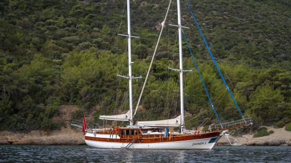 The Gulet Jasemin 1 anchored off the scenic coast of Bodrum, perfect for a luxurious yacht vacation.