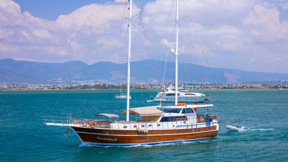 The Gulet Kasapoglu 6 sails through the clear blue waters off the coast of Fethiye, Turkey.