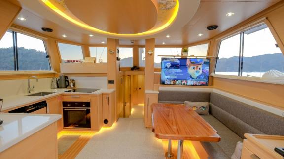 Modern interior of the 3-cabin Gulet Limonata in Göcek, Turkey, featuring a kitchen and TV area.