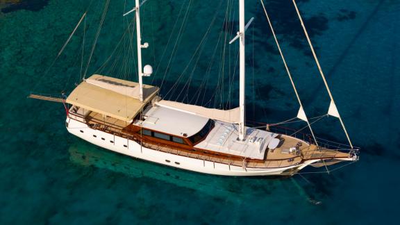 Mein Schatz is anchored in crystal-clear waters, perfect for a weekly luxury yacht charter in Turkey.