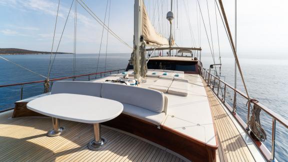 The foredeck of Mein Schatz, with sun loungers and a cozy seating area, is perfect for gulet charter in Bodrum.