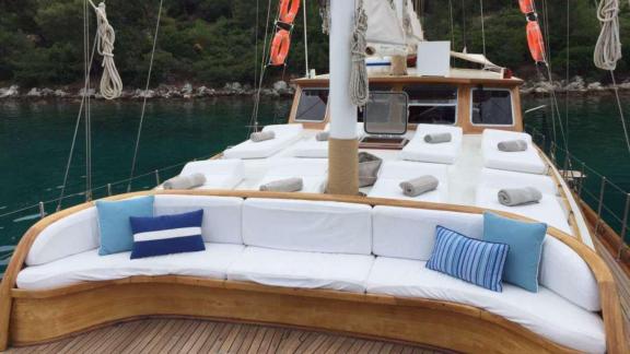 Spacious sun deck on Gulet Miramare with comfortable loungers and seating area, perfect for relaxing on board.