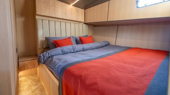 Princess Alize gulet features a comfortable double cabin with a spacious bed and elegant wooden interior onboard.