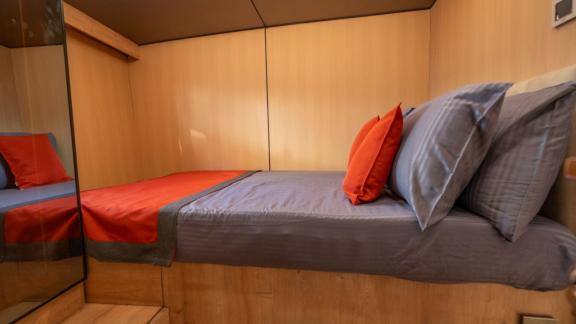 Princess Alize gulet features a comfortable double bed cabin with modern wooden details onboard.