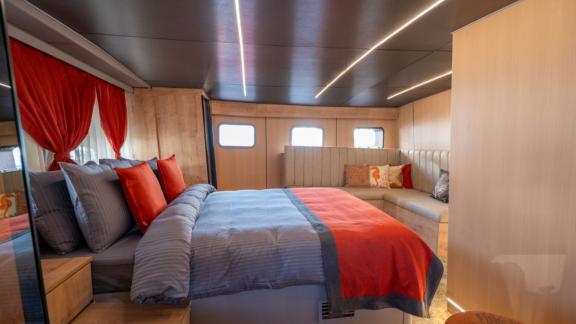 Princess Alize gulet features a large master cabin with a comfortable bed and elegant seating area onboard.
