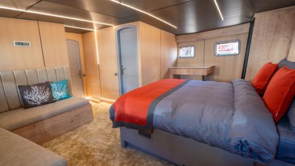 Princess Alize gulet features a spacious master cabin with a large bed and comfortable seating area onboard.