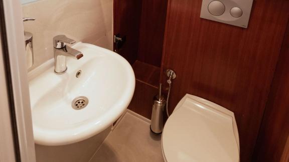 Among Fethiye yacht rental options Queen Alin bathroom shows sink and toilet in compact onboard space.