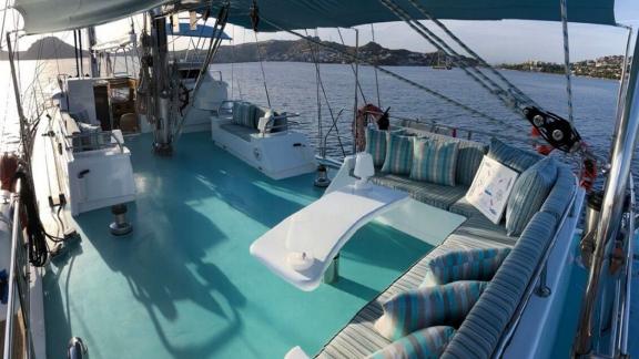 Enjoy the spacious upper deck of a Gulet in Göcek, perfect for relaxation and sea views.