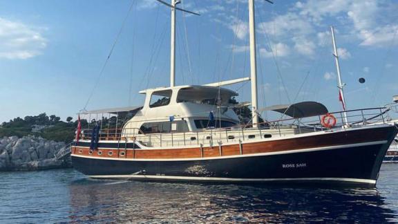 Gulet Rose Sah is anchored in a quiet cove, offering a peaceful sea view.