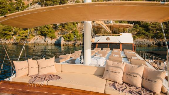 The Gulet Rüya features a comfortable lounge with Moët & Chandon pillows and a stunning view.