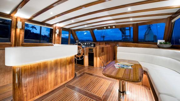 Luxurious interior of Serenad A featuring a wheelhouse and comfortable lounge area.