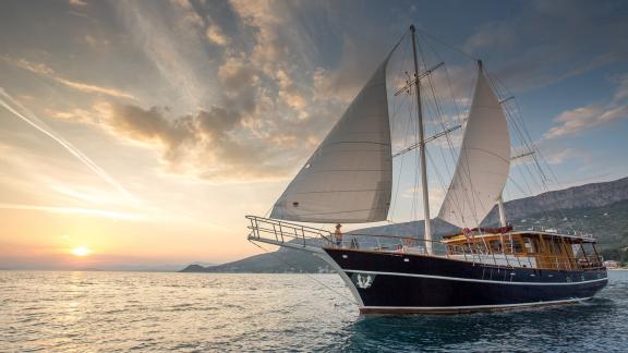 Gulet Altair, yacht in Split, Croatia, at sunset, 6 cabins, ideal for sailing holidays.