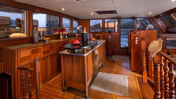 Stylish on-board bar with wooden interior and modern equipment, ready for sociable evenings.