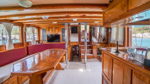 Stylish interior with wooden furniture and panoramic windows. Perfect for cozy moments onboard.