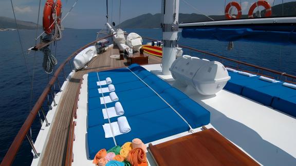 Relax on the spacious sun deck of Sunworld 8 with stunning sea views.