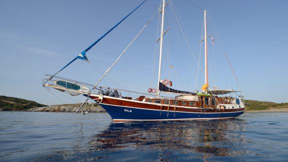 The elegant Gulet Sıla anchored off the coast of Bodrum, perfect for relaxing sailing trips.