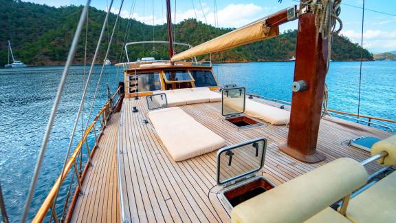 Sunbeds on the deck of Gulet Thalasa overlooking the Turkish coast.