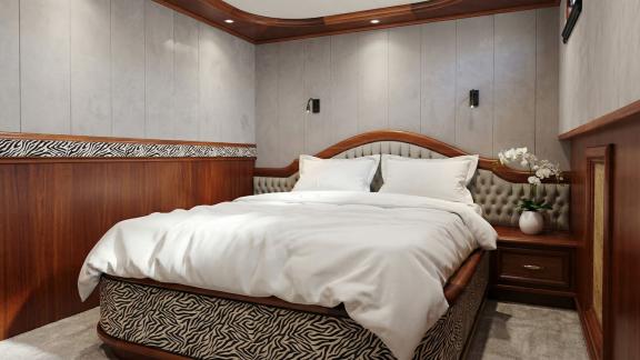 In Marmaris Gulet chartern Option Tosca Kabine mit bequemem Bett und schlichtem Design für komfortable Nutzung.