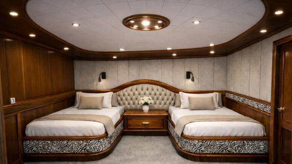 In Marmaris gulet charter option Tosca twin cabin with two beds and spacious design offering comfortable onboard stay.