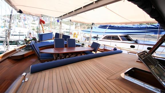 Stylish seating area and luxurious deck on our Gulet, perfect for relaxation in Bodrum's harbor.