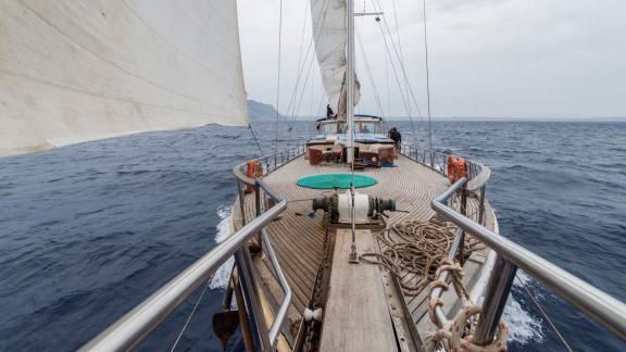 Deck of Gulet Valerie sailing on the wavy open sea.